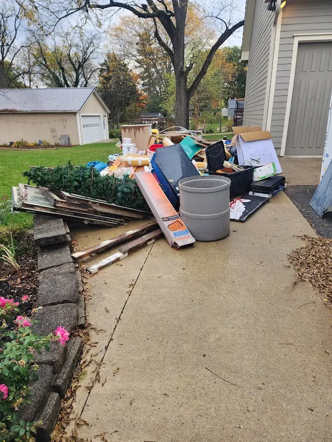 Dumpster being loaded with debris for Residential Dumpster Rental in Brewster